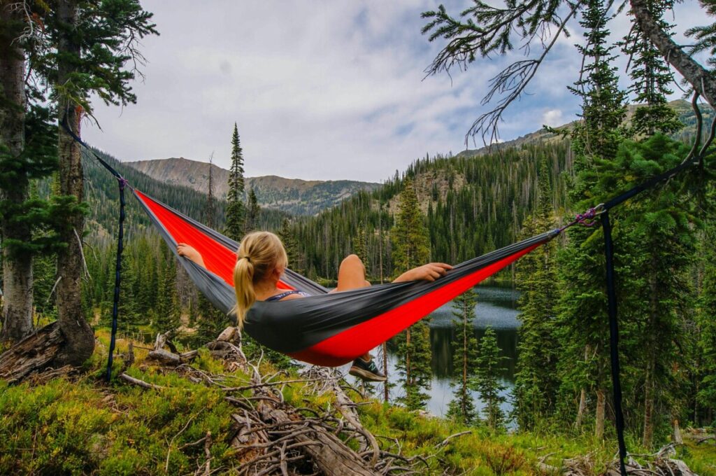 a person chilling in a hammock